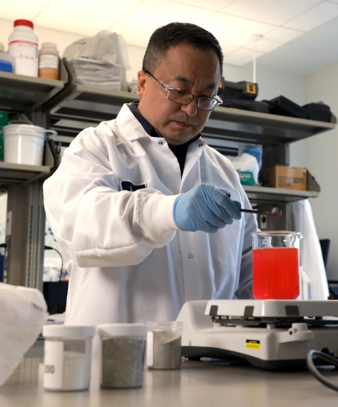 Scientist Testing Red Liquid