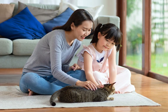 Mother and daughter with cat